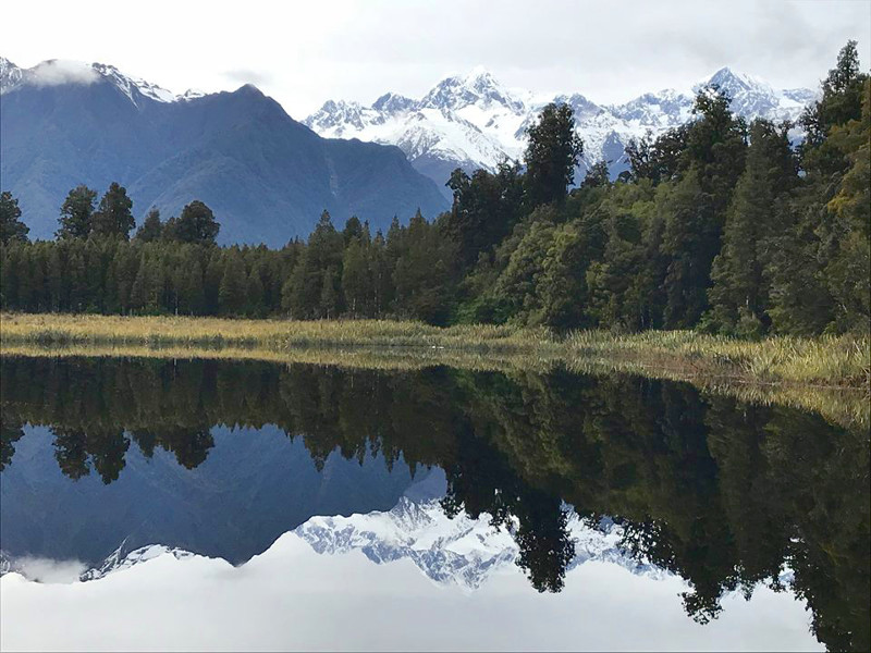 Mirror reflection on Lake Matheson of Aoraki Mt. Cook