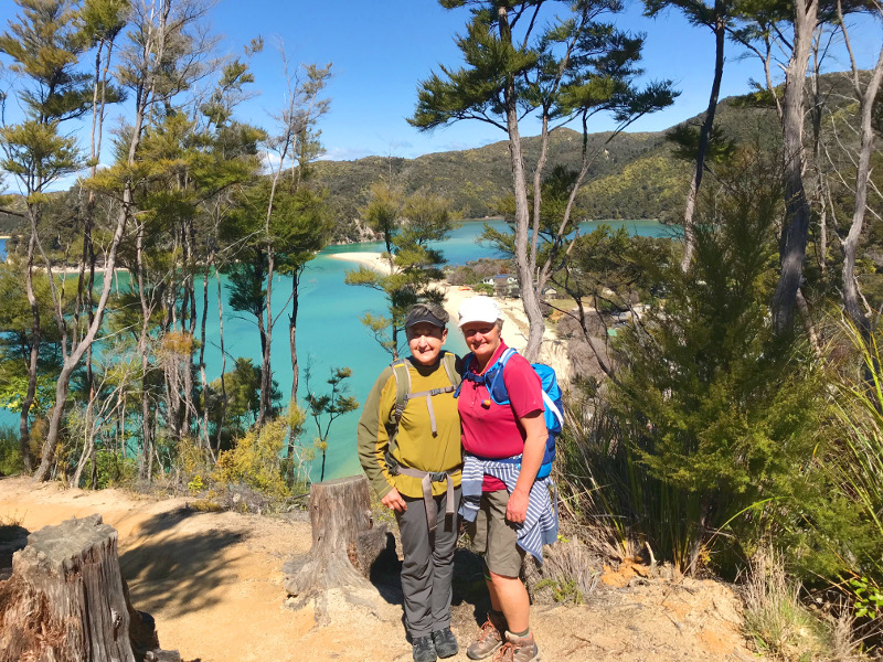 Mary with local Yvonne in front of turquoise waters in Abel Tasman National Park